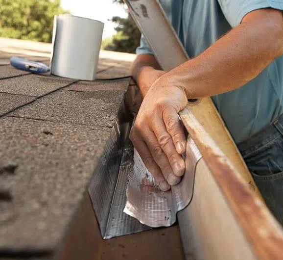 Technician repairing a gutter